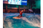 ThumbnailEin Pro Surfer auf der stehenden Welle während der Pure Surf Night in der Jochen Schweizer Arena